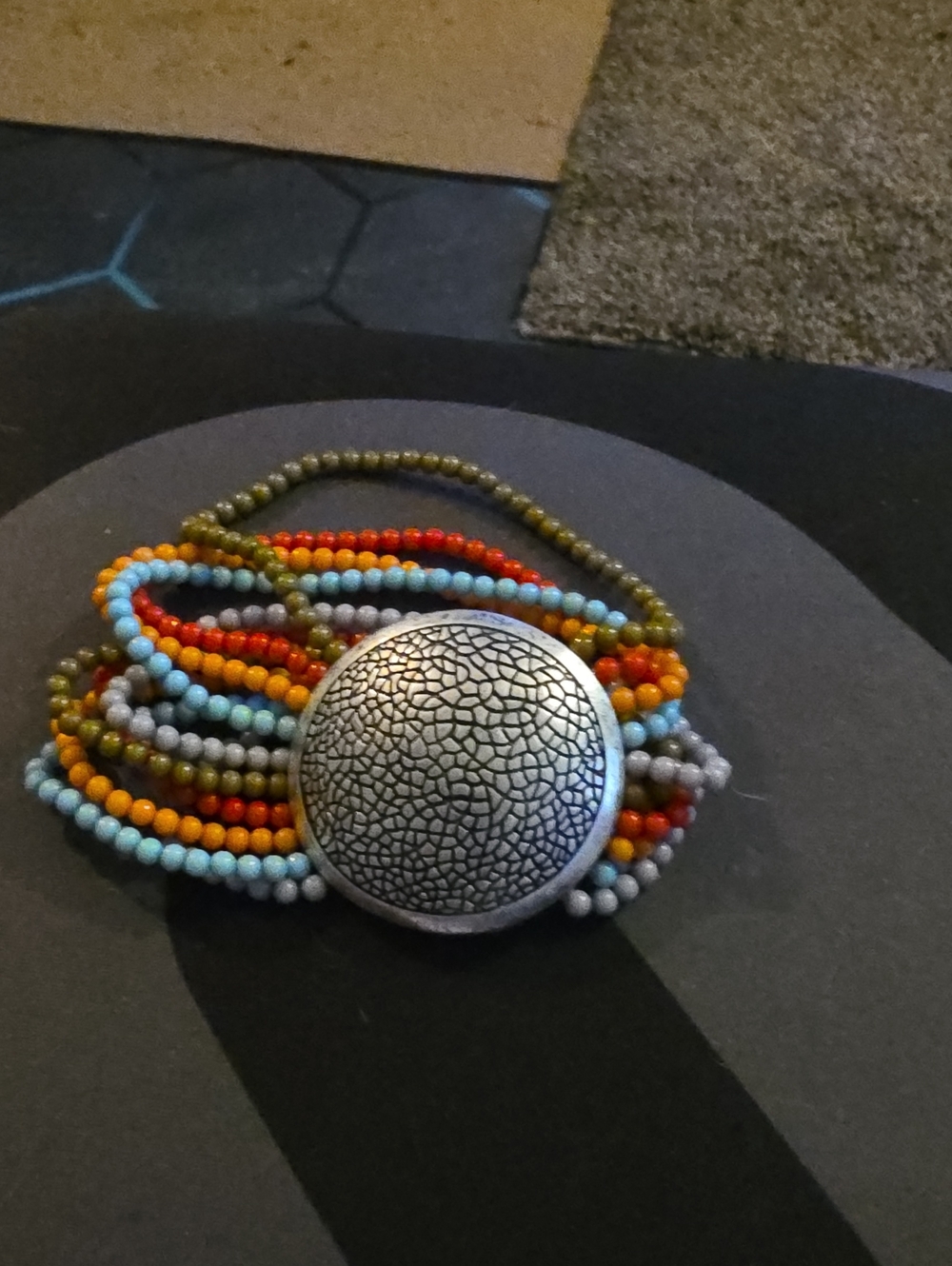 Multi-Color Beaded Statement Bracelet with Textured Silver Disc